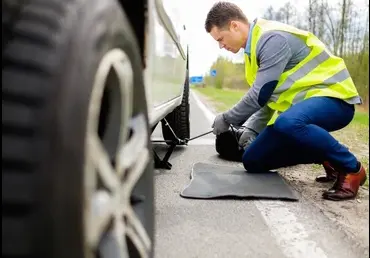 Technician performing mobile tyre repair