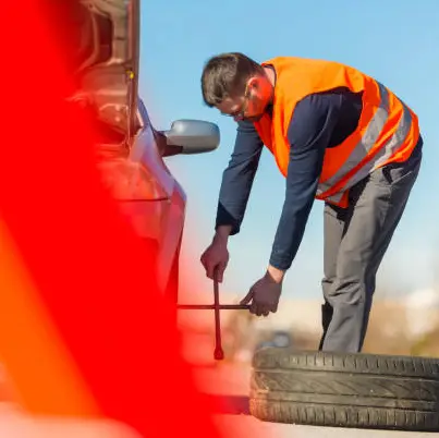 Mobile tyre repair technician at work